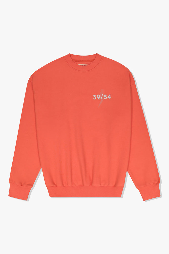 Front of Mami Wata 39/54 Summer Sweat in coral with 39/54 lightning detail – cotton brushed fleece crewneck