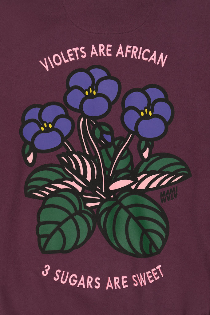 Close-up of back print on violet hoody by Mami Wata